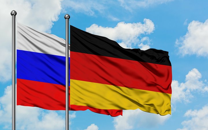 Russia and Germany flag waving in the wind